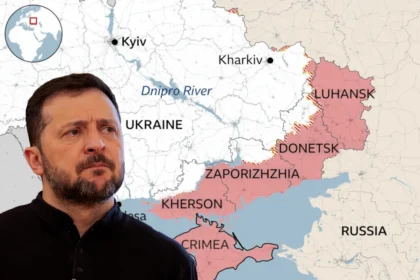 Zelensky con sullo sfondo la mappa del Donetsk
